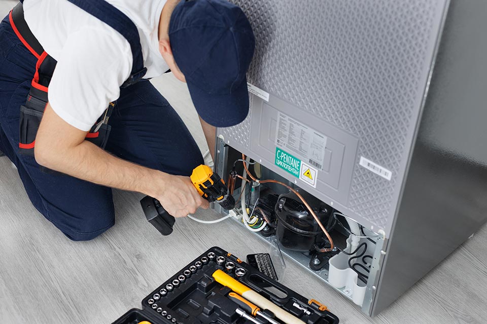Technician-Fixing-a-Fridge